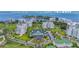 Aerial view of Bellair Country Club, showcasing its buildings, landscaping, and waterfront location at 6 Hibiscus Ln, Belleair, FL 33756