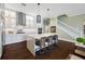 Modern kitchen with white cabinets, large island, and stainless steel appliances at 6 Hibiscus Ln, Belleair, FL 33756