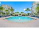 Refreshing pool area with a fountain and plenty of lounge chairs at 6 Hibiscus Ln, Belleair, FL 33756