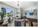 Open living space with a large window, fireplace, and stylish decor at 6 Hibiscus Ln, Belleair, FL 33756