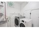 Bright laundry room with stackable washer and dryer at 10355 Paradise Blvd # 1010-1011, St Petersburg, FL 33706