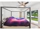 Bedroom with water views and a canopy bed at 15504 Race Track Rd, Odessa, FL 33556