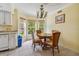 Kitchen dining area with table and chairs, and view to backyard at 2210 Utopian E Dr # 206, Clearwater, FL 33763