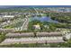 Aerial view of an apartment building community near a lake at 2210 Utopian E Dr # 206, Clearwater, FL 33763