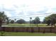 Serene view of a golf course and pond from the backyard at 12297 Croft Dr, Largo, FL 33774