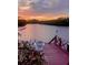 Stunning sunset view from backyard dock, perfect for relaxing evenings by the water at 1964 Arvis E Cir, Clearwater, FL 33764