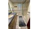 Bathroom featuring a vanity, toilet and tiled walk-in shower at 1964 Arvis E Cir, Clearwater, FL 33764