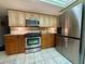 Modern kitchen with stainless steel appliances and a functional layout at 1964 Arvis E Cir, Clearwater, FL 33764