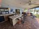 Charming kitchen features a tiled island, ample counter space, and relaxing water views at 1964 Arvis E Cir, Clearwater, FL 33764