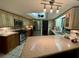 Well-equipped kitchen featuring stainless steel appliances and granite countertops at 1964 Arvis E Cir, Clearwater, FL 33764