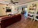 Open-concept living room featuring tile flooring, modern decor, and an open layout at 1964 Arvis E Cir, Clearwater, FL 33764