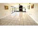 Spacious living room showcasing tile floors and a fireplace with brick surround at 1964 Arvis E Cir, Clearwater, FL 33764