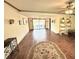Spacious living area boasts tile flooring and sliding glass doors to an outdoor view at 1964 Arvis E Cir, Clearwater, FL 33764