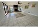 Bright living space featuring tile floors, a brick fireplace, and sliding door access at 1964 Arvis E Cir, Clearwater, FL 33764