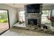 Living room featuring a fireplace, tiled floors and neutral walls at 1964 Arvis E Cir, Clearwater, FL 33764