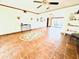 Bright living room featuring tile floors, ceiling fan, and ample space for entertaining at 1964 Arvis E Cir, Clearwater, FL 33764