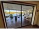 Covered patio with seating overlooking the water at 1964 Arvis E Cir, Clearwater, FL 33764