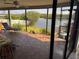 Relaxing porch with lounge chair offers serene views of the water at 1964 Arvis E Cir, Clearwater, FL 33764