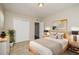 Main bedroom with light wood bed frame and neutral decor at 10119 N Ola Ave, Tampa, FL 33612