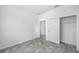 Simple bedroom with grey flooring and a large closet at 7535 62Nd N Way, Pinellas Park, FL 33781