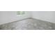 Simple bedroom with grey vinyl flooring and a window at 7535 62Nd N Way, Pinellas Park, FL 33781