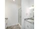 Modern bathroom with double vanity, granite countertop, and glass shower at 7535 62Nd N Way, Pinellas Park, FL 33781