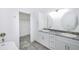 Bathroom with double vanity, granite countertop, and walk-in closet at 7535 62Nd N Way, Pinellas Park, FL 33781