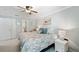 King-size bed in a grey bedroom with ensuite bathroom at 5257 Beach Se Dr # D, St Petersburg, FL 33705