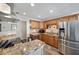 Updated kitchen featuring granite countertops and stainless steel appliances at 5257 Beach Se Dr # D, St Petersburg, FL 33705