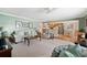 Open living room featuring a comfortable sofa and access to the kitchen at 5257 Beach Se Dr # D, St Petersburg, FL 33705