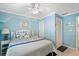 Spacious bedroom with a king-size bed and ceiling fan at 5257 Beach Se Dr # D, St Petersburg, FL 33705