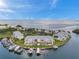 Aerial view of waterfront community with boat slips and lush landscaping at 5257 Beach Se Dr # D, St Petersburg, FL 33705