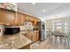 Modern kitchen featuring granite countertops and stainless steel refrigerator at 5257 Beach Se Dr # D, St Petersburg, FL 33705