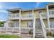 Two-story building with patio and stairs at 5257 Beach Se Dr # D, St Petersburg, FL 33705