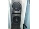 Compact laundry room with a stacked washer and dryer at 5257 Beach Se Dr # D, St Petersburg, FL 33705