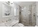 Updated bathroom with a walk-in shower and modern vanity at 5257 Beach Se Dr # D, St Petersburg, FL 33705
