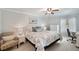 Bedroom with king-size bed, dresser, and an armchair at 5257 Beach Se Dr # D, St Petersburg, FL 33705