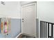 Condo entryway with white door and fire extinguisher at 5257 Beach Se Dr # D, St Petersburg, FL 33705