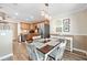 Charming dining area with a wooden table and four chairs near the kitchen at 5257 Beach Se Dr # D, St Petersburg, FL 33705