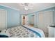 King-size bed in a blue and white themed bedroom with ample closet space at 5257 Beach Se Dr # D, St Petersburg, FL 33705
