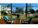 Sunroom with table and chairs overlooking pool at 6363 Gulf Winds Dr # 131, St Pete Beach, FL 33706