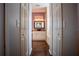 Bathroom with double doors and a view into the Primary bath at 7323 Night Heron Dr, Land O Lakes, FL 34637