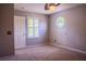 Bedroom with ceiling fan, window shutters and carpet at 7323 Night Heron Dr, Land O Lakes, FL 34637