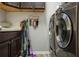 Laundry room with washer, dryer, and ample storage at 7323 Night Heron Dr, Land O Lakes, FL 34637