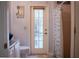 Bathroom with door to backyard and shower/tub combo at 7323 Night Heron Dr, Land O Lakes, FL 34637