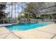 Inviting screened pool with pergola and spa at 7323 Night Heron Dr, Land O Lakes, FL 34637