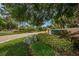 Community entrance with landscaped grounds and signage at 1008 Caravel Ct, Tarpon Springs, FL 34689