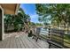 Deck overlooking a pond with seating at 1008 Caravel Ct, Tarpon Springs, FL 34689