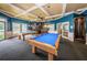 Community game room with two billiard tables and a rich color scheme at 1008 Caravel Ct, Tarpon Springs, FL 34689