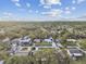 Aerial view of houses, roads, and lush green landscape at 831 Searcy Ave, Sarasota, FL 34237
